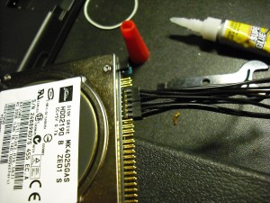 Glued 2.0MM connectors curing on a laptop HD.