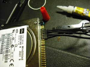 Glued 2.0MM connectors curing on a laptop HD.